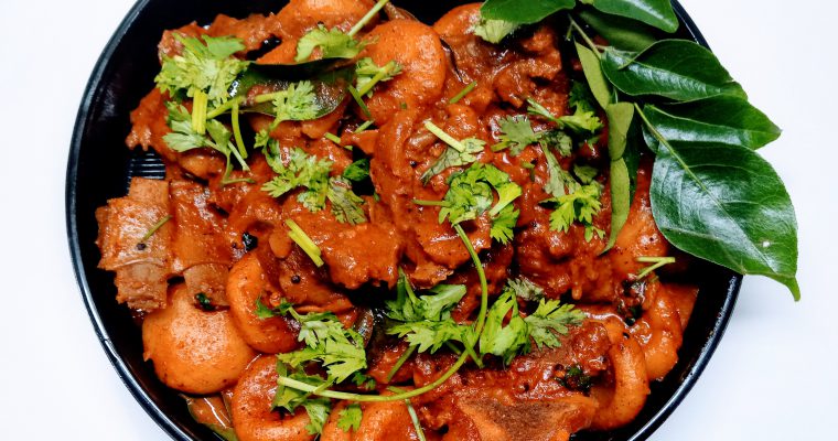 Mutton pidi (rice dumplings with mutton curry)